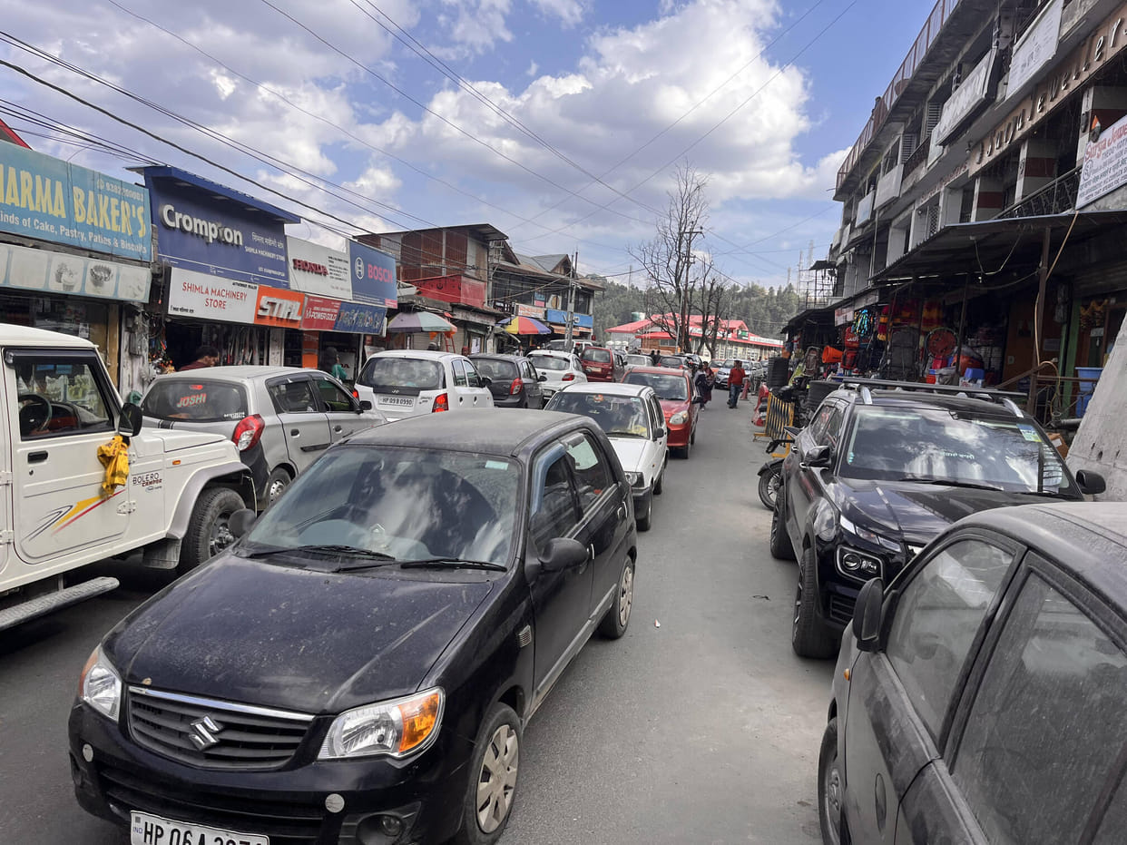 Vehicles parked on the roadside in Theog city are creating obstruction in traffic