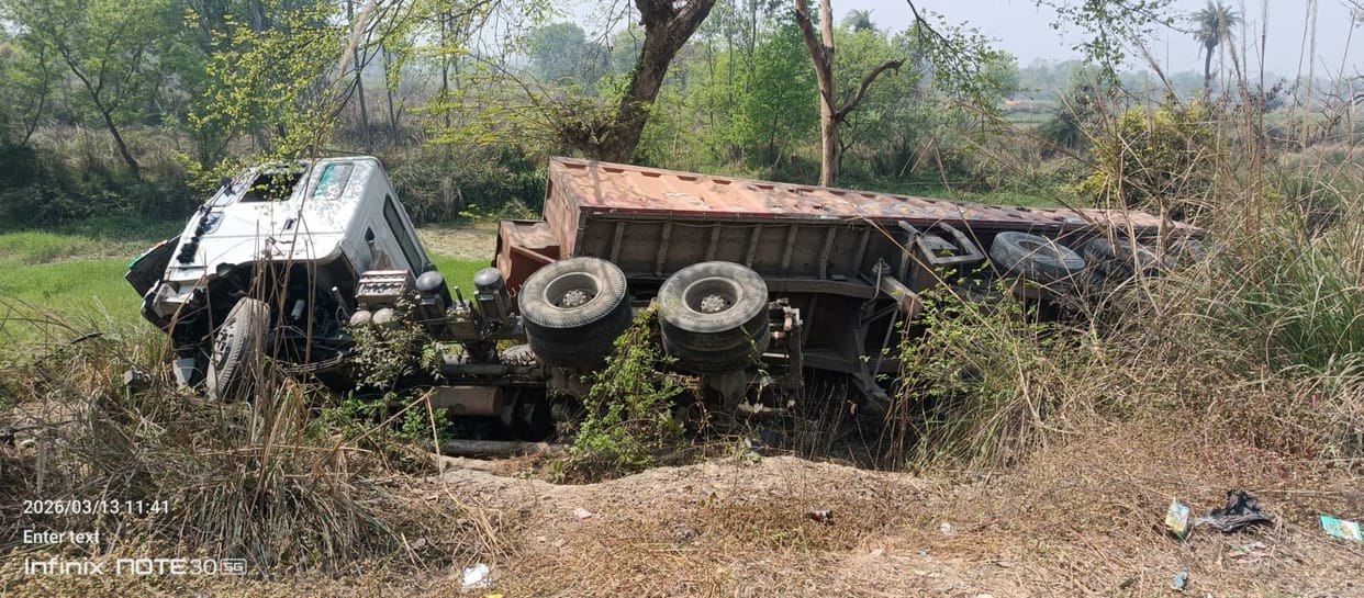 A trailer loaded with gravel went out of control and overturned into a ditch.