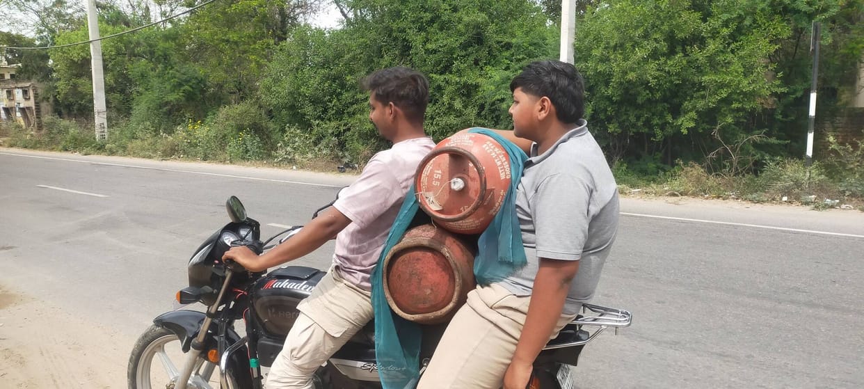 People forced to cook on traditional stoves due to the unavailability of gas cylinders.