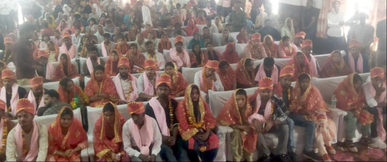 52 took the vows, 18 couples got married
