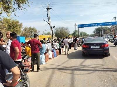 People lined up outside the agency as early as 6:00 AM to get work.