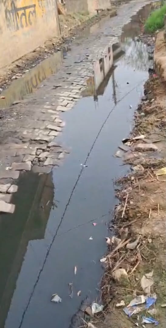 The main road of Nagla Sahajan has turned into a drain, causing trouble for the villagers.