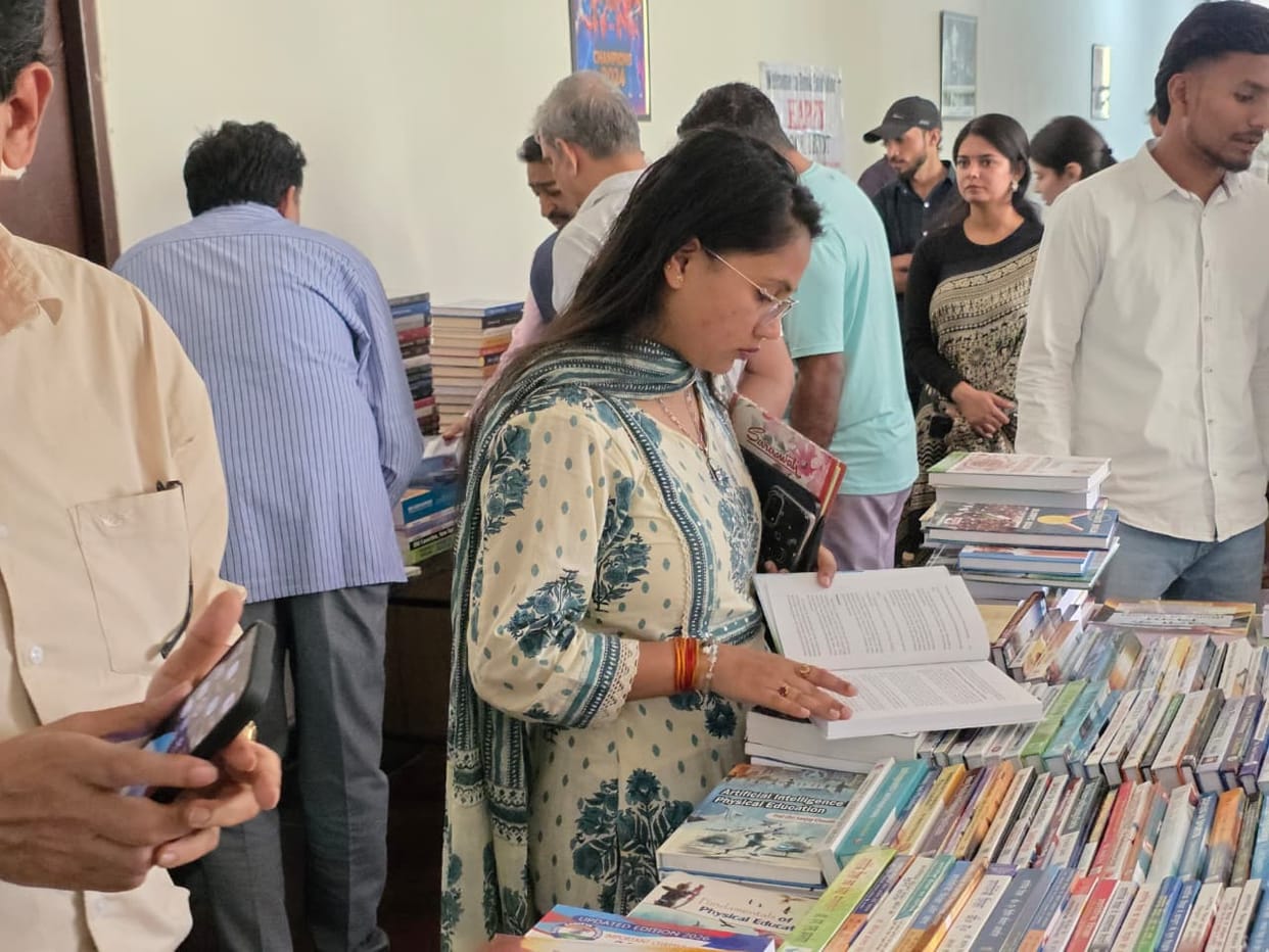 Book exhibition held at Sports University, displaying over 6,000 books