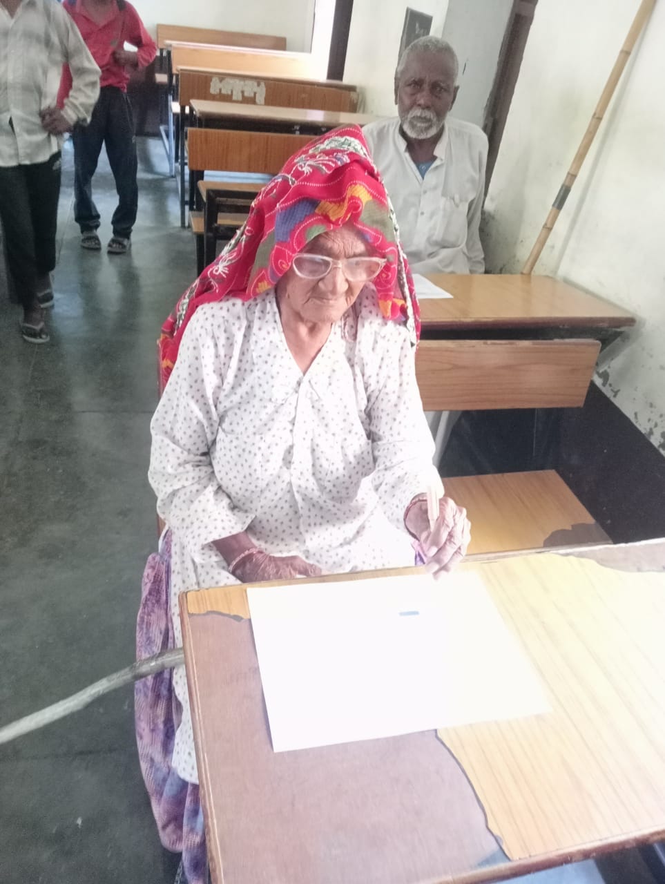 With trembling hands, the elderly are honoring the knowledge, in Sarsana 98-year-old Dhapa Devi gave a joyous exam along with her 80-year-old son.