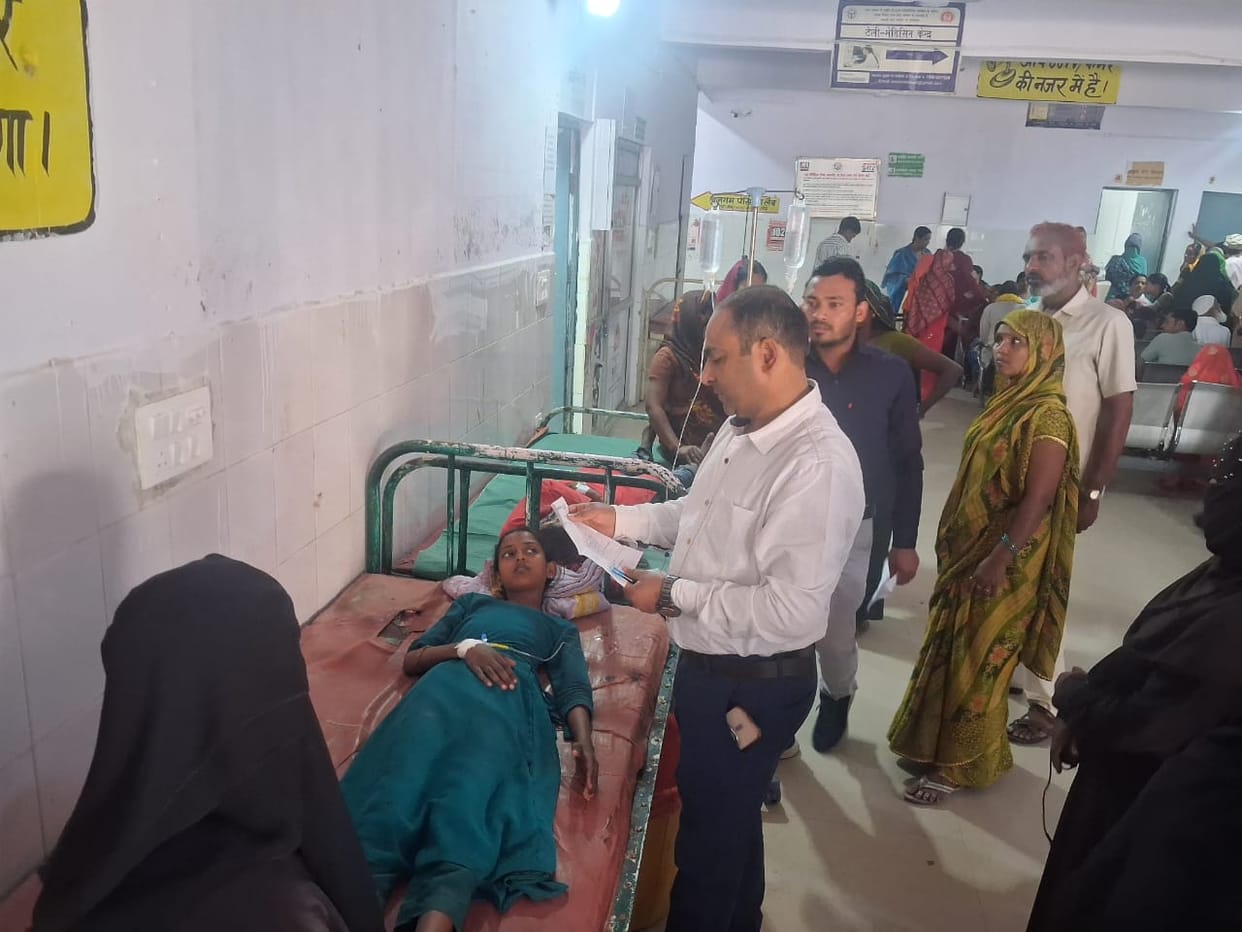 Two teenage girls fell unconscious after being electrocuted by a hand pump.