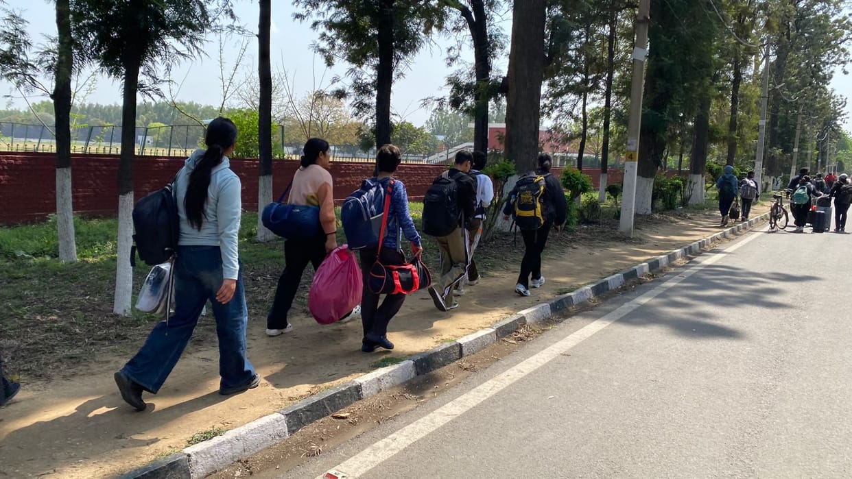 Autos stopped at the gate, players reached the stadium on foot