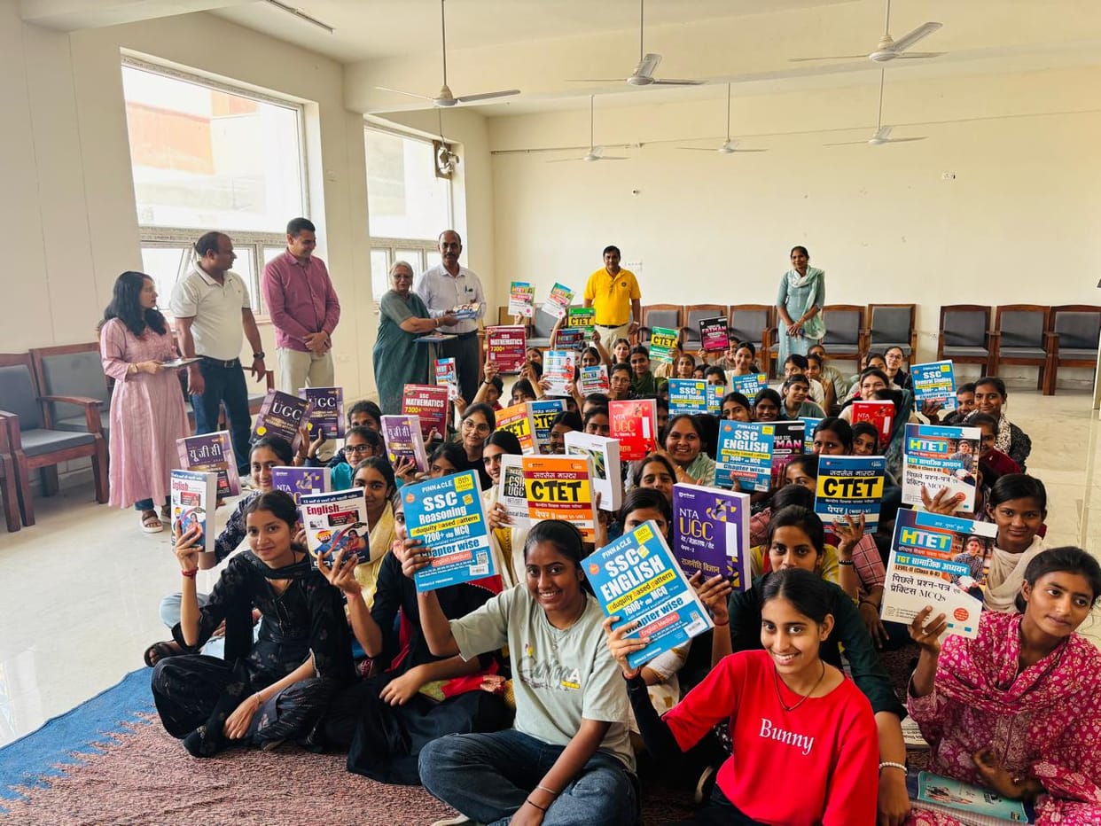 Competitive exam books were given to the girl students.