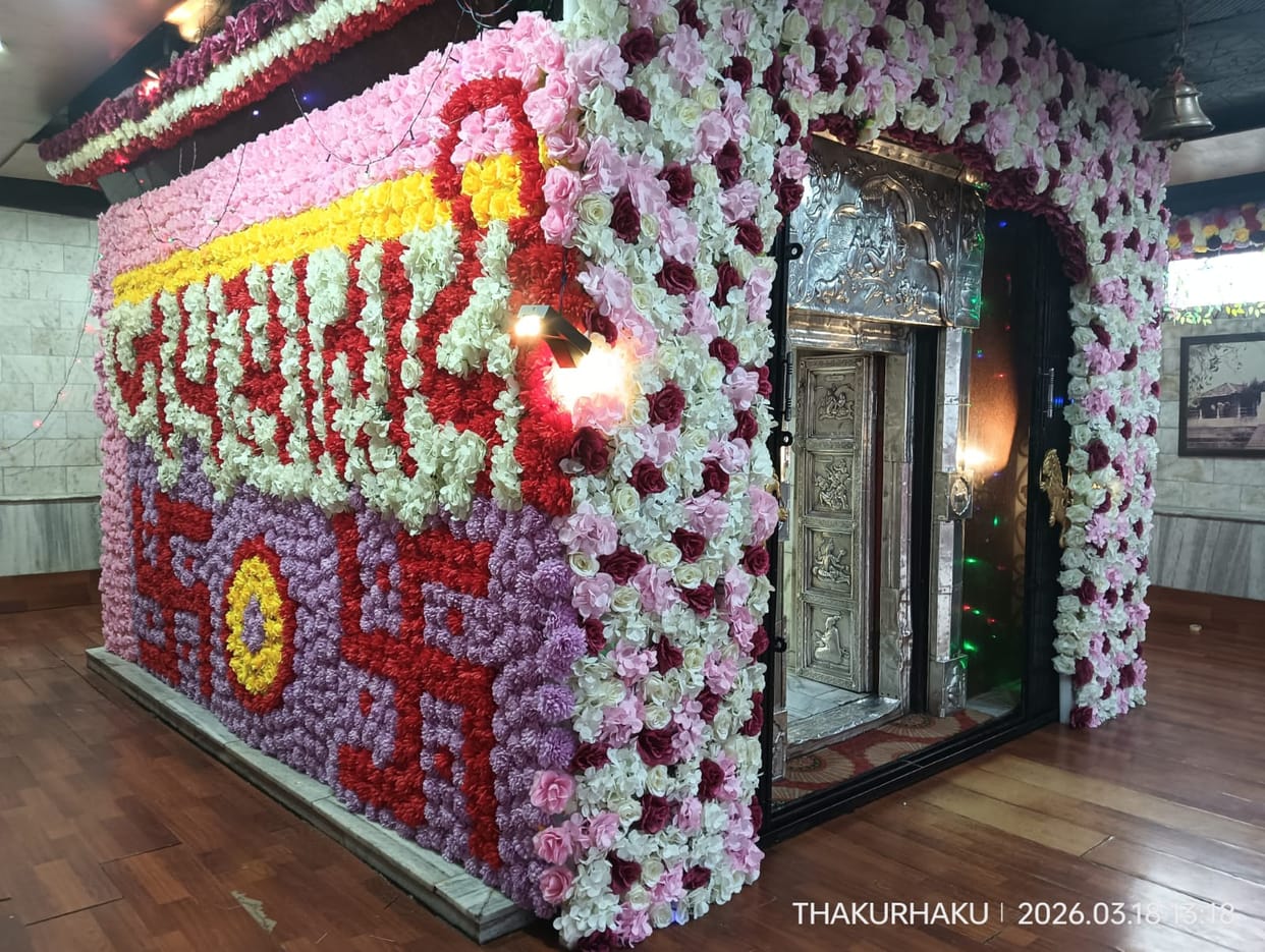The court of Maa Bhalei is decorated with colorful electronic lights and flowers.