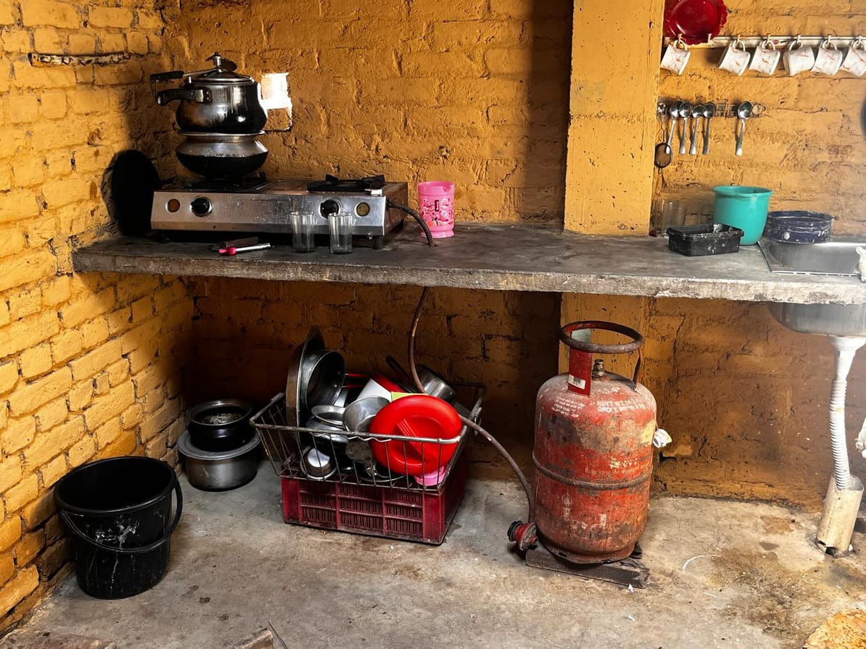With no gas cylinder available, the flame returned to the traditional stove after years.