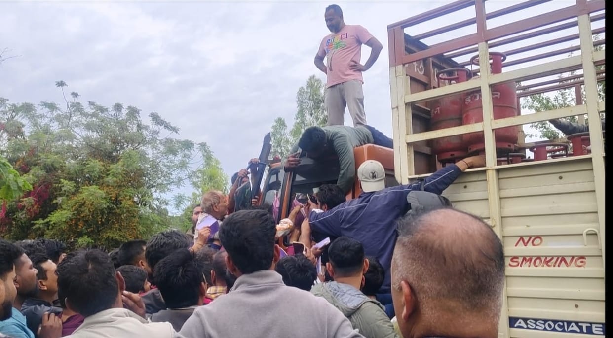 A scuffle broke out over the cylinder, and people climbed onto the truck, forcing the police to be called.