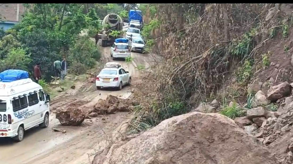 Bus narrowly escapes being hit by debris falling from a hill in Magal