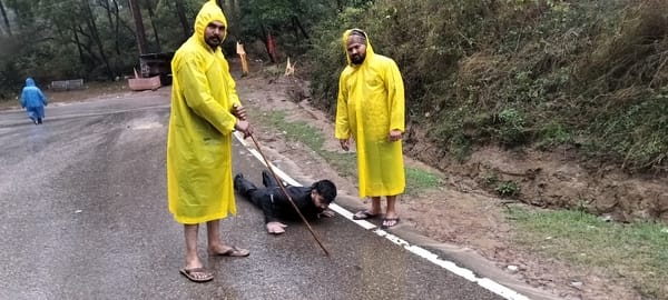 Devotees are reaching Baba's court by doing Dandavat Pranam amidst the rain.