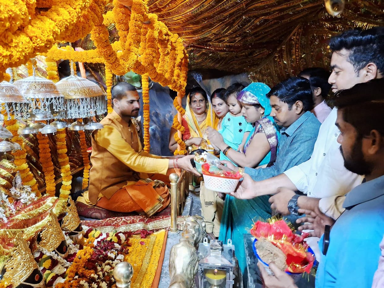 As soon as the doors of Sheetla temple opened, there was a rush of devotees.