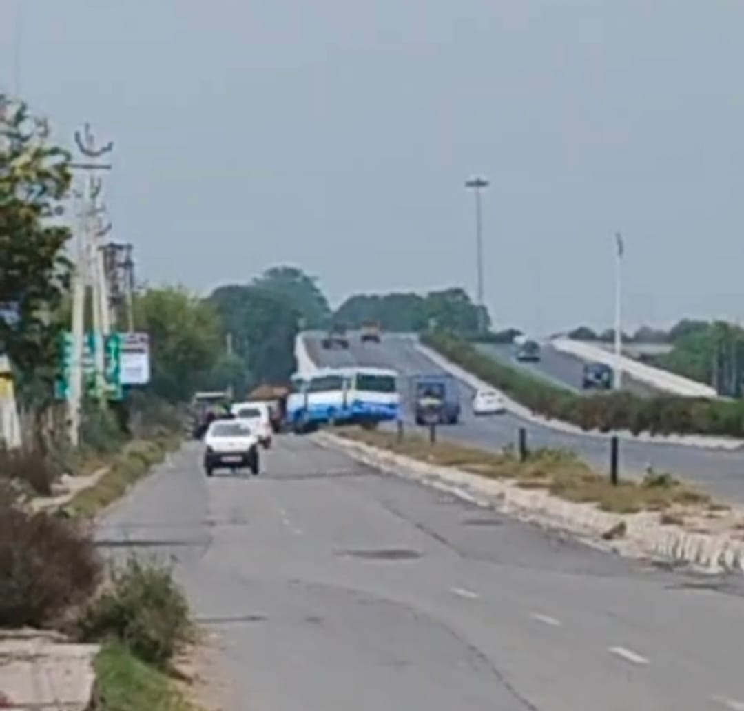 Bus takes wrong turn on National Highway, climbs over divider