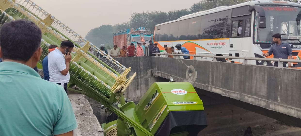 Combine Harvester Crashes Through Bridge Railing and Hangs Precariously; One Dead, Two Injured
