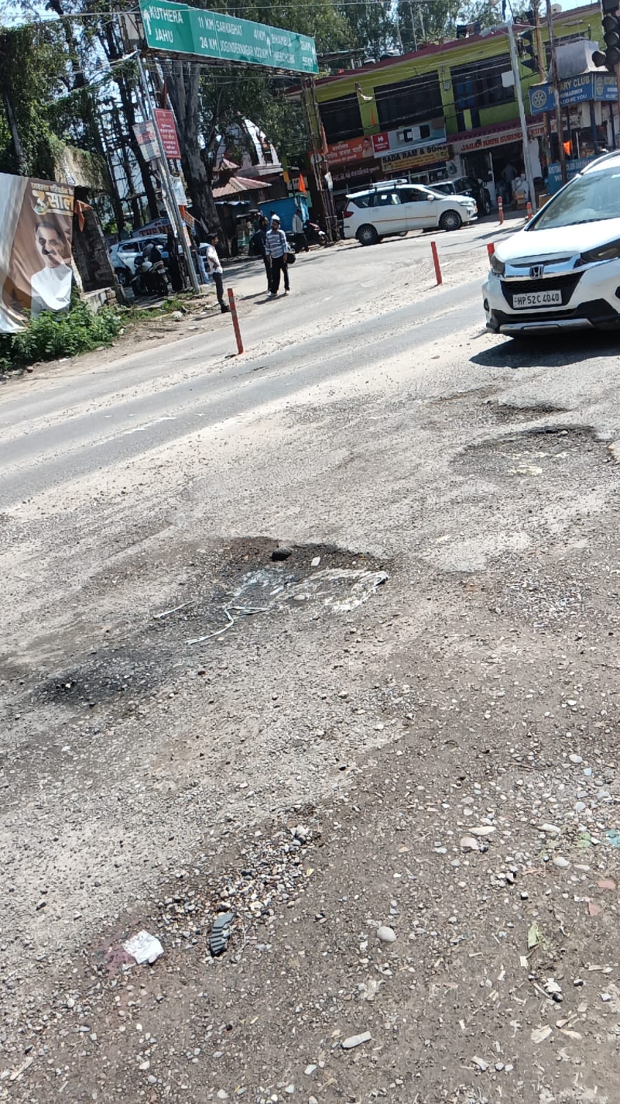Deep potholes at Dakri Chowk cause accidents, scooter rider injured