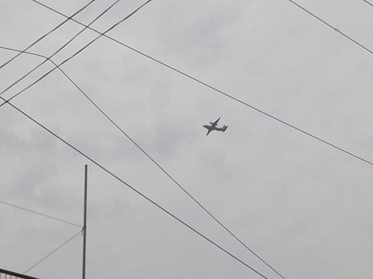 People were frightened by the roar of fighter jets in the sky, climbing onto rooftops to watch the scene.