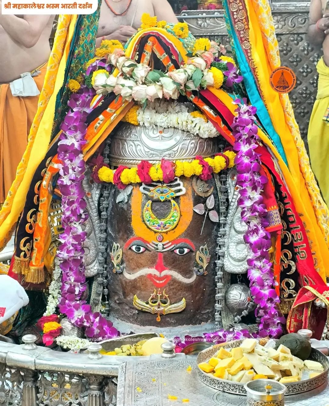 Baba Mahakal adorned Vaishnav Tilak, Bhasma Aarti performed cymbals, drums conch shells.