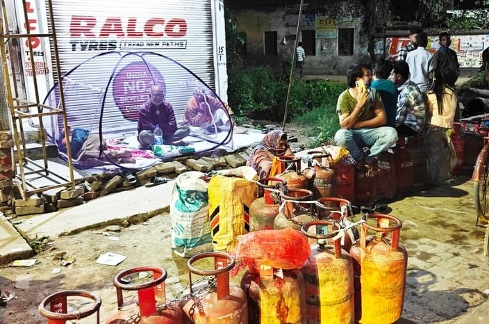People sat under mosquito nets all night for gas and blocked roads during the day.