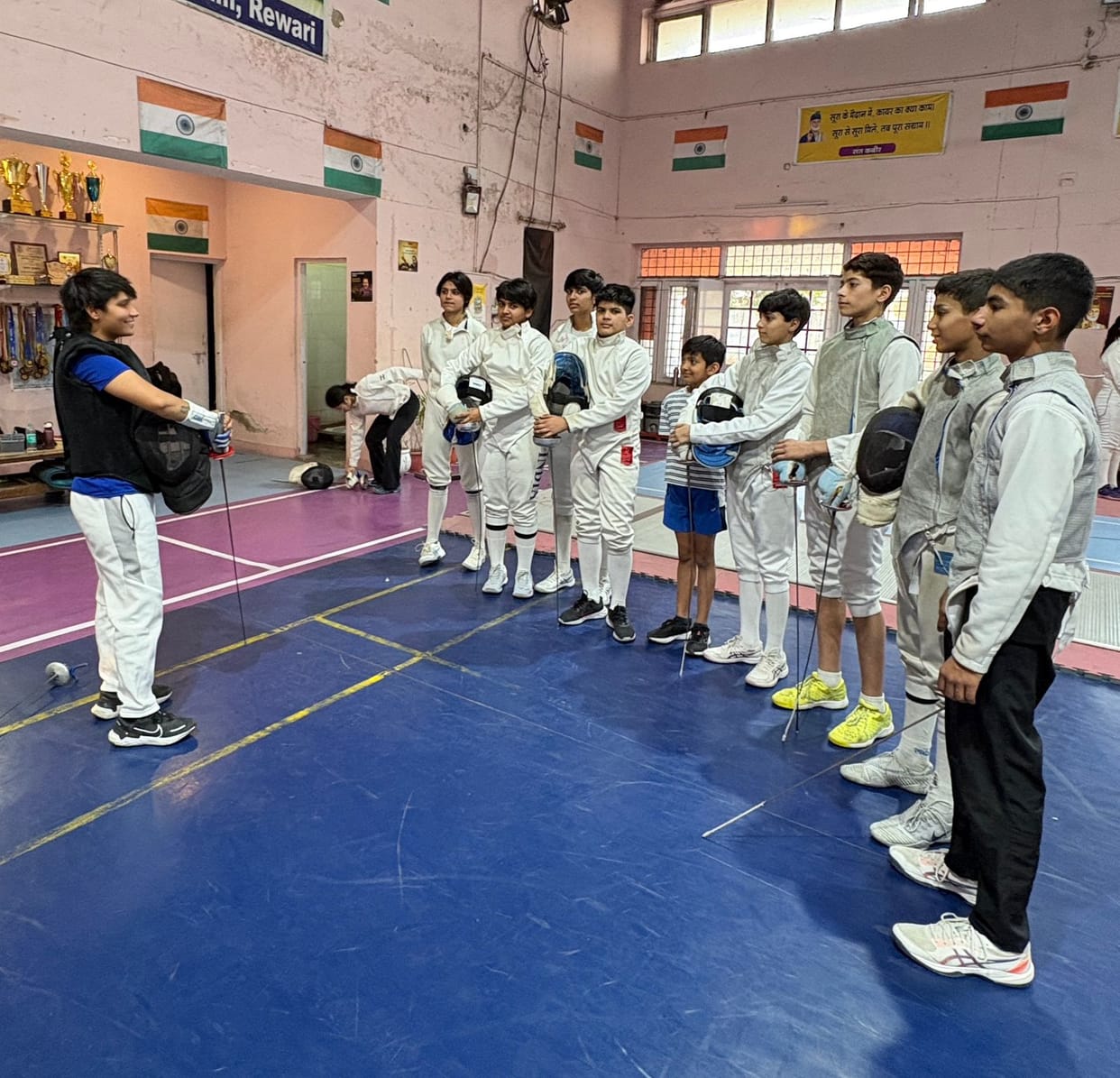 Isha became a fencing coach at the same stadium where she trained seven years ago.