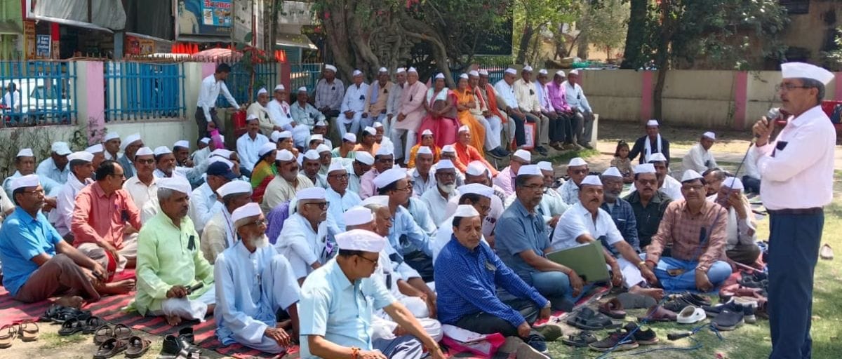 Pensioners staged a sit-in protest wearing black bands.
