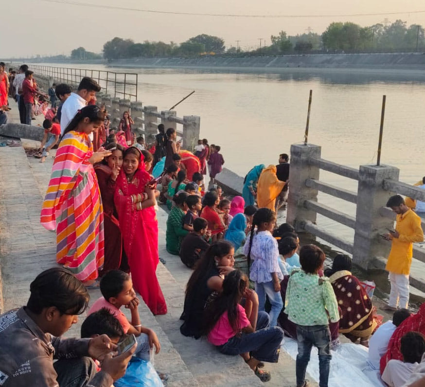 Standing in water for hours and worshipping Lord Surya