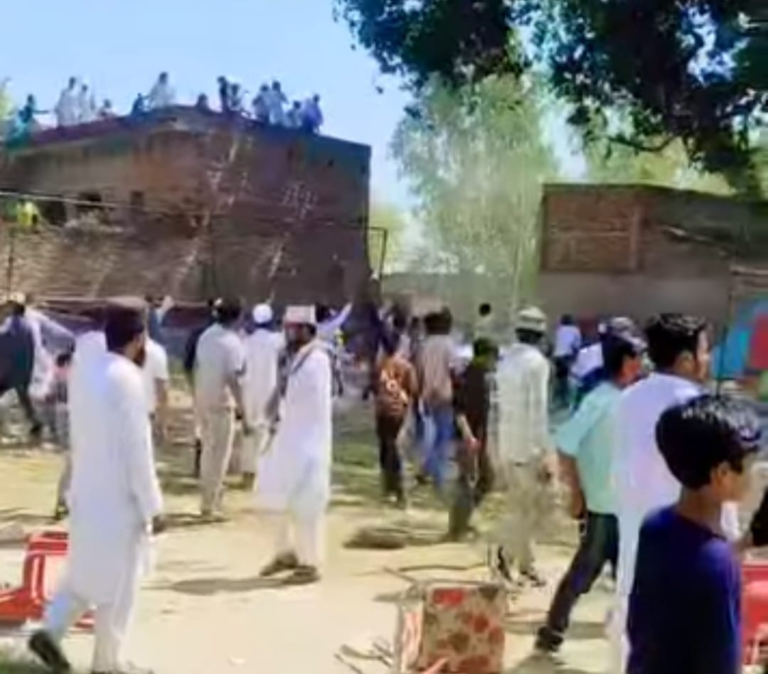 Two sides clashed over the route to the shrine, leading to heavy stone pelting; a wall collapsed, and 12 people were detained.