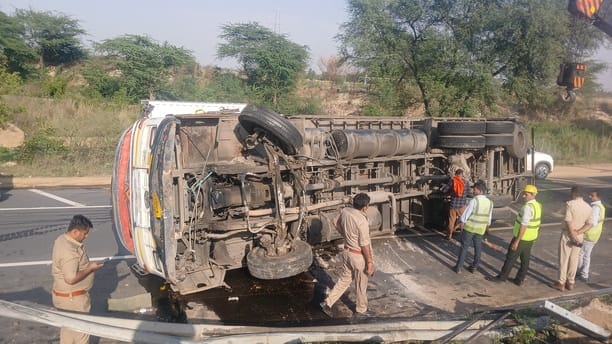 Container overturned uncontrollably, driver injured