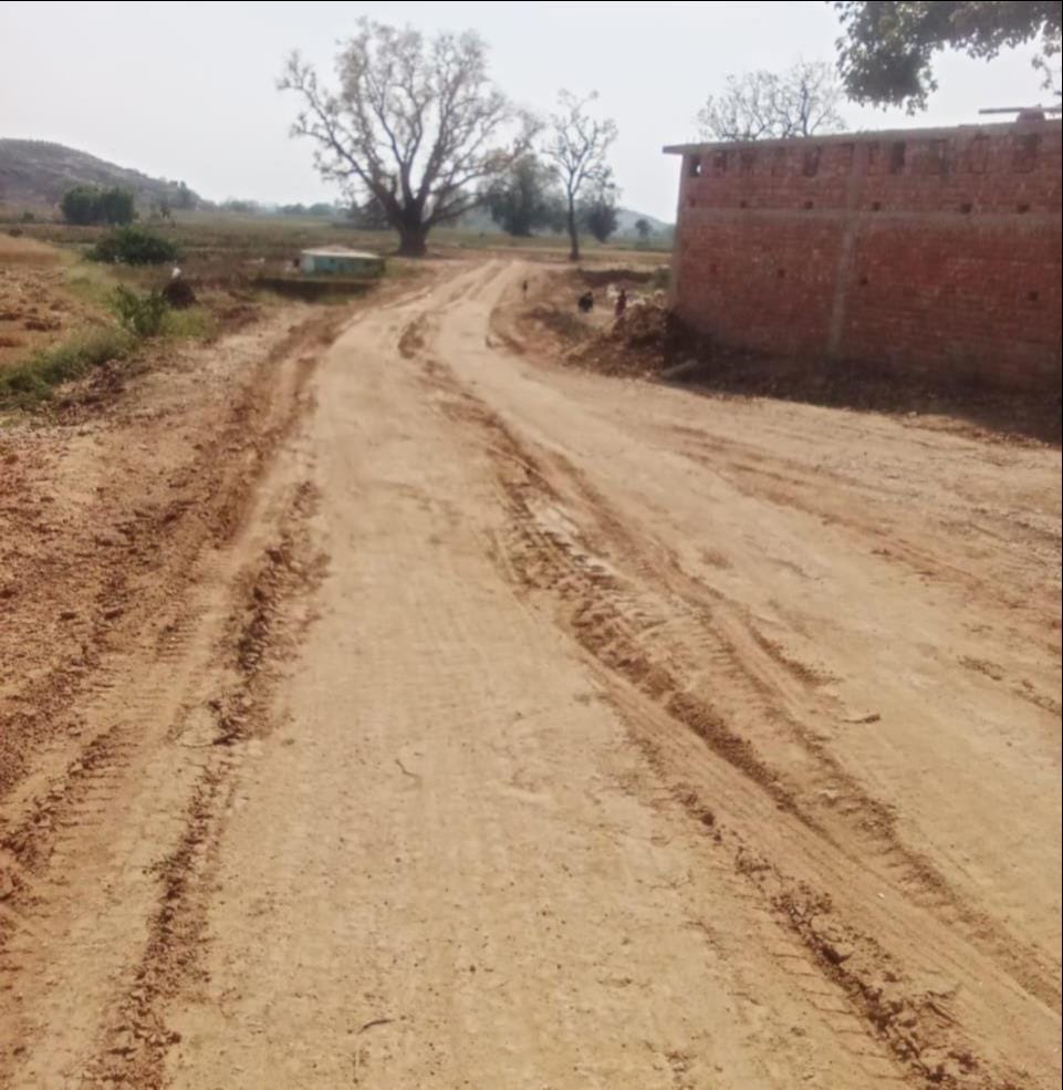 Overloaded vehicles gave the asphalt road a mud-like texture.