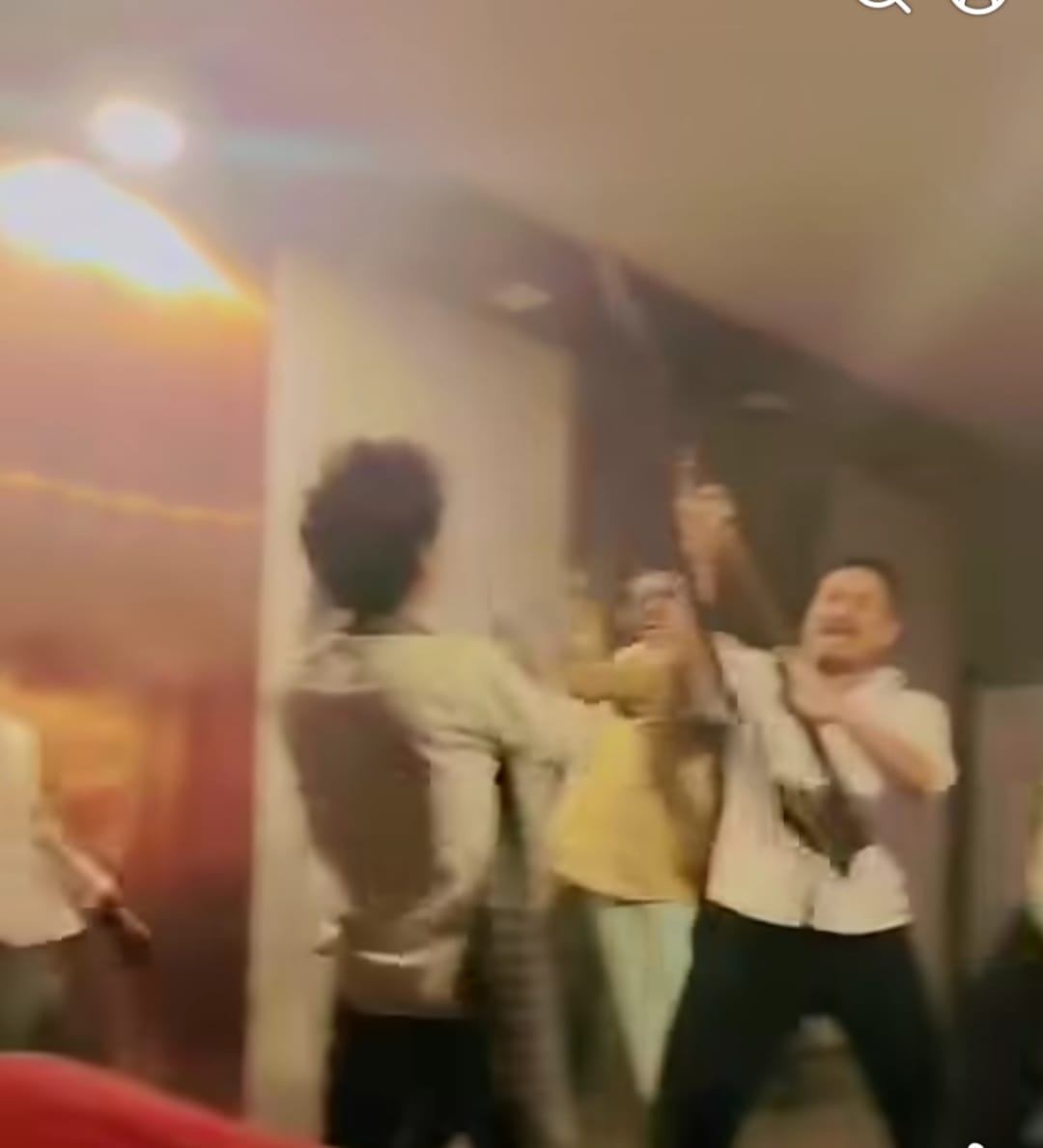 Video of youths dancing with weapons in a cafe goes viral