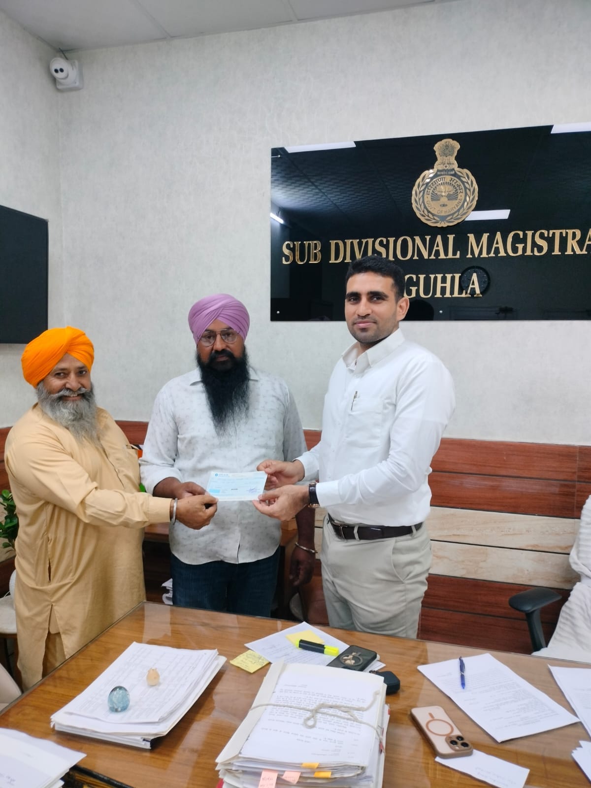 A cheque of Rs 1 lakh was handed over to the family of Haryana topper Arpandeep