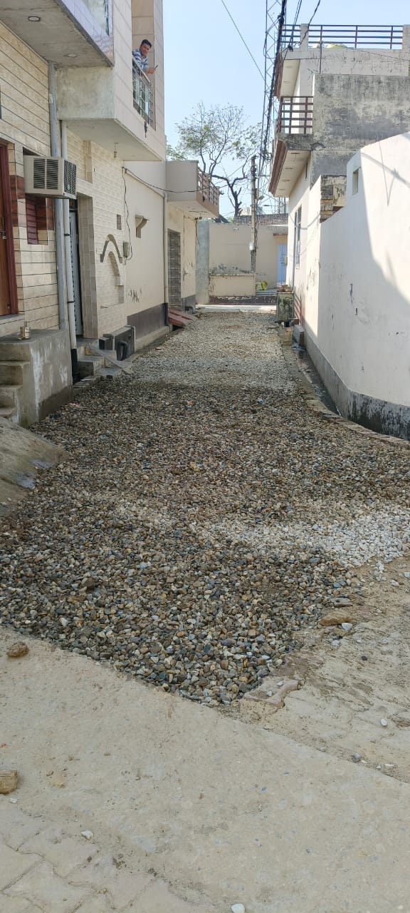 Children are getting injured due to gravel spread on the road, no one is taking any action.