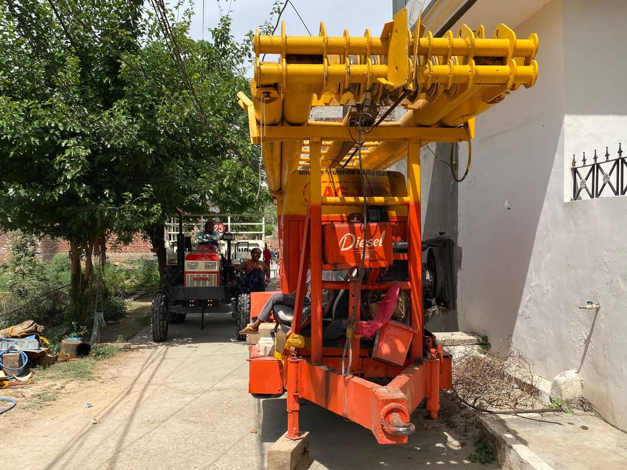 Controversy erupts over installation of a government tubewell in Mangal Nagar; residents prevent workers from lifting the material.