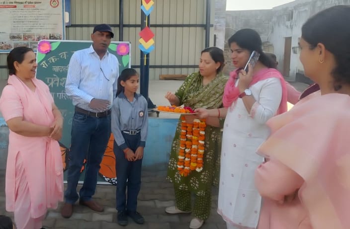 Students were welcomed at the gate of the PM Shri Government School with a *tilak*.