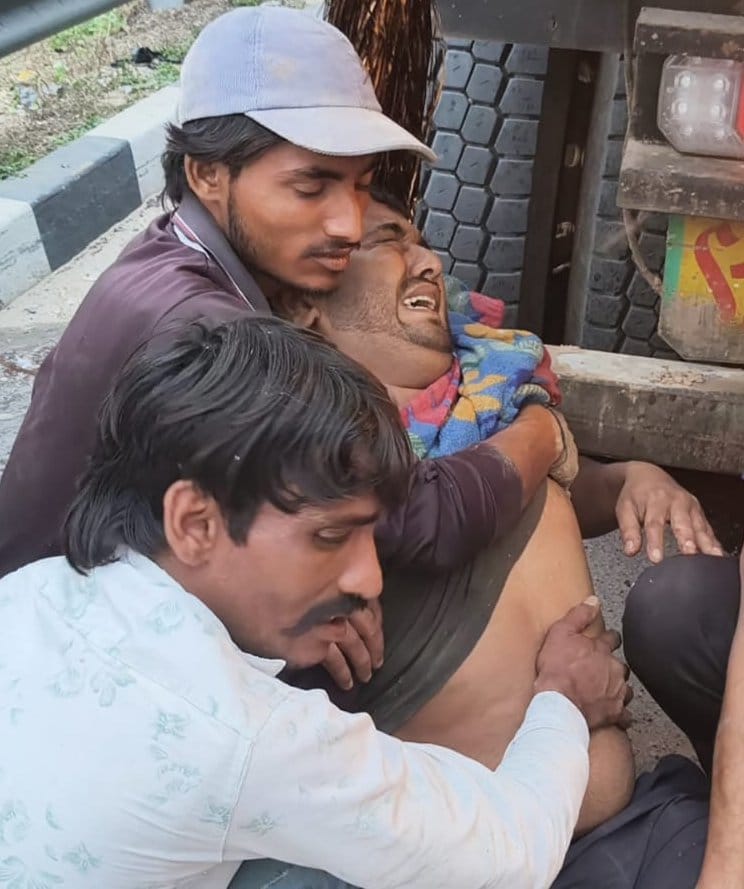The canter driver and assistant were left in agony after the accident, while people kept looting chickens.