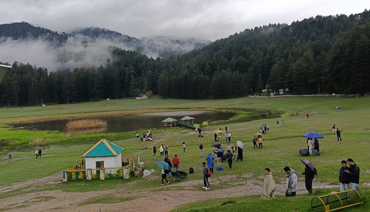 Wearing an umbrella and a raincoat, I admired the valleys of Khajjiar in the rain.