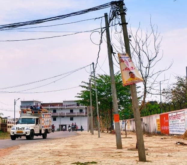 No footpath... a dangerous path with electric poles in the middle