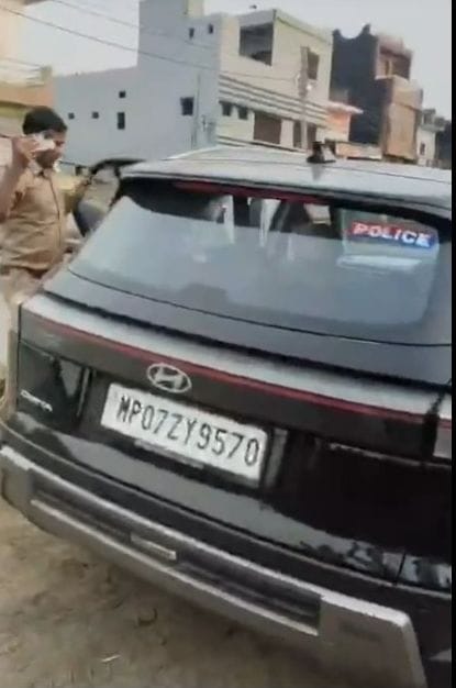 People dressed in police uniform beat up a former councillor and his son.