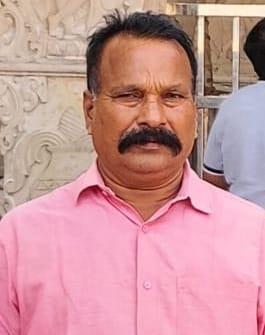 While throwing garbage from the roof, he touched a 33,000 volt line and died.