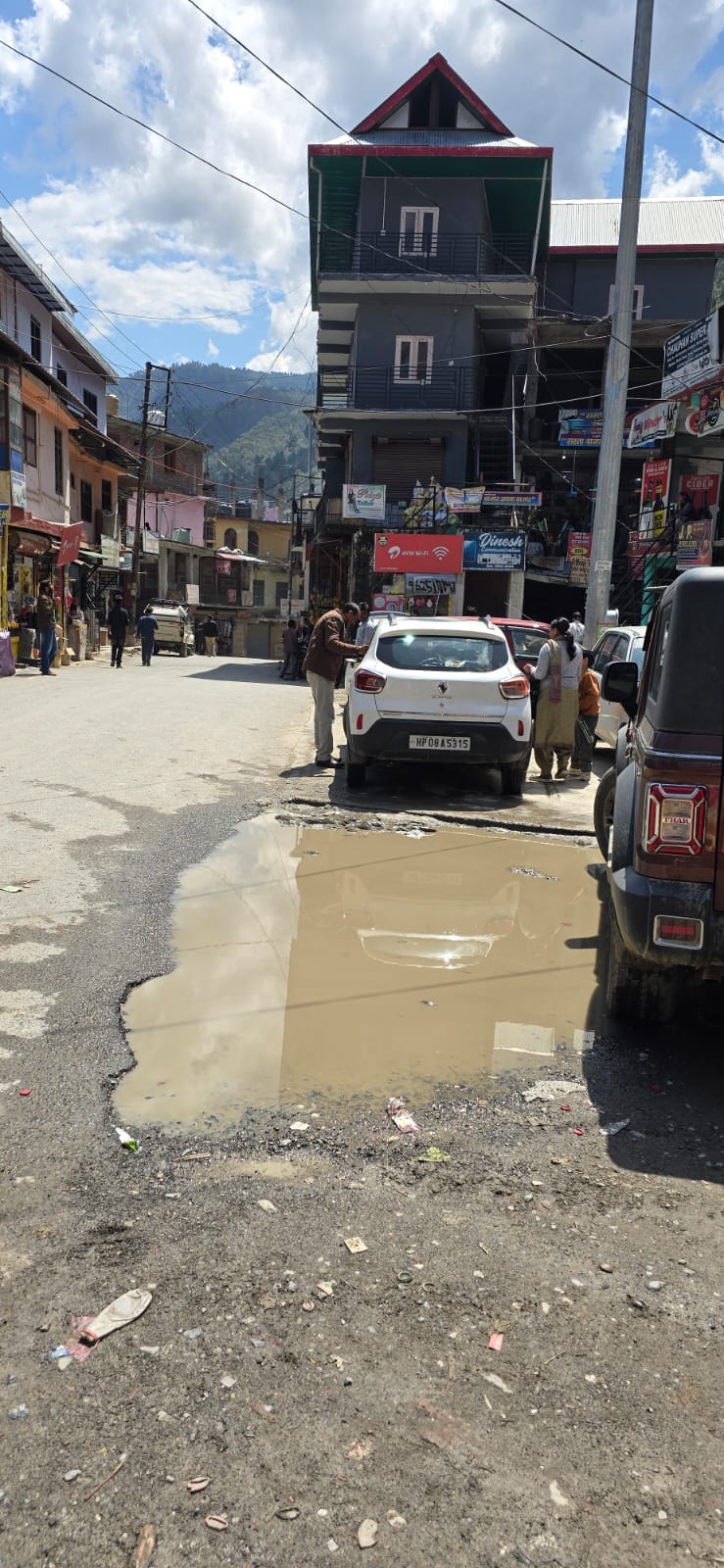Potholes on the road create problems for people
