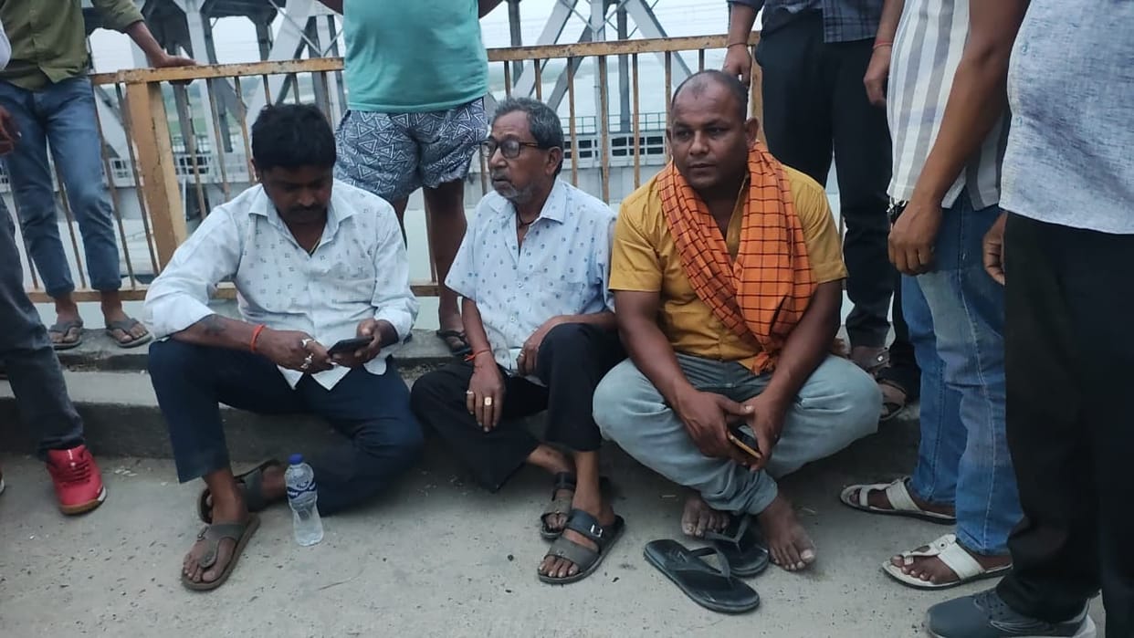The trailer broke the railing of the bridge after hitting the pickup and fell into the Ganga