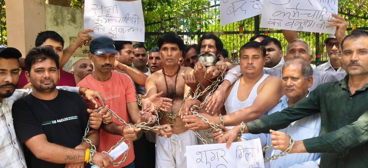 Contract workers of the sugar mill staged a protest by going half naked.