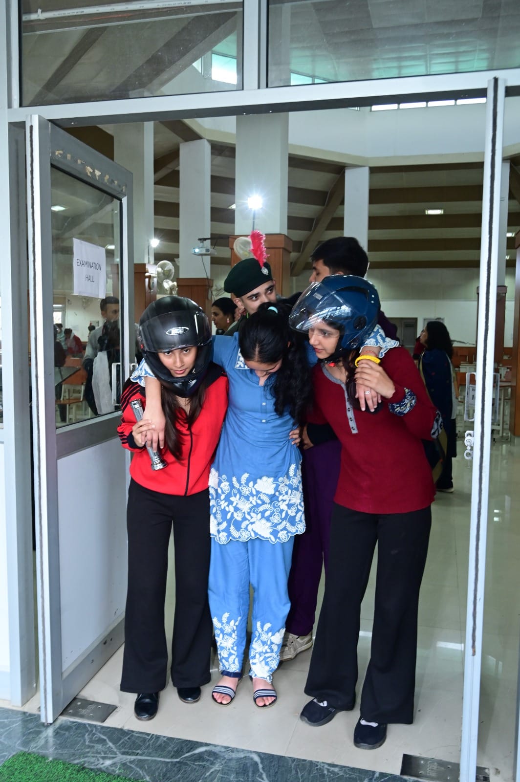 Strong aftershocks caused debris to fall, injuring several students.