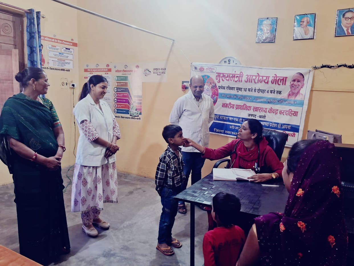 Patients suffering from skin and viral infections queue up at the Jan Arogya Mela