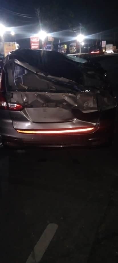 The truck overturned on the car after going into the other lane.