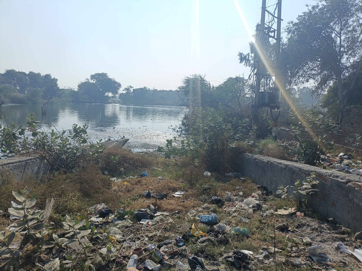 A pile of garbage in the pond near the school in Pyuda village