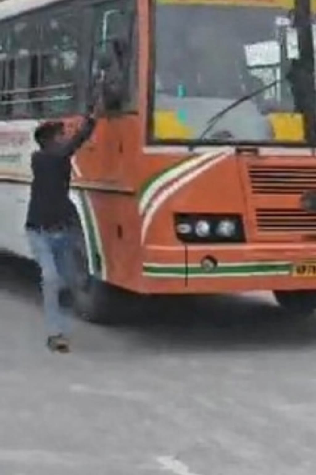 Bus runs with youth hanging from window, video goes viral