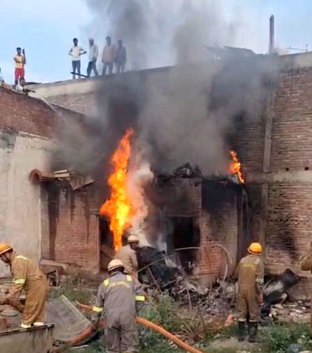 A fire broke out in a garbage dump, engulfing a fibre warehouse