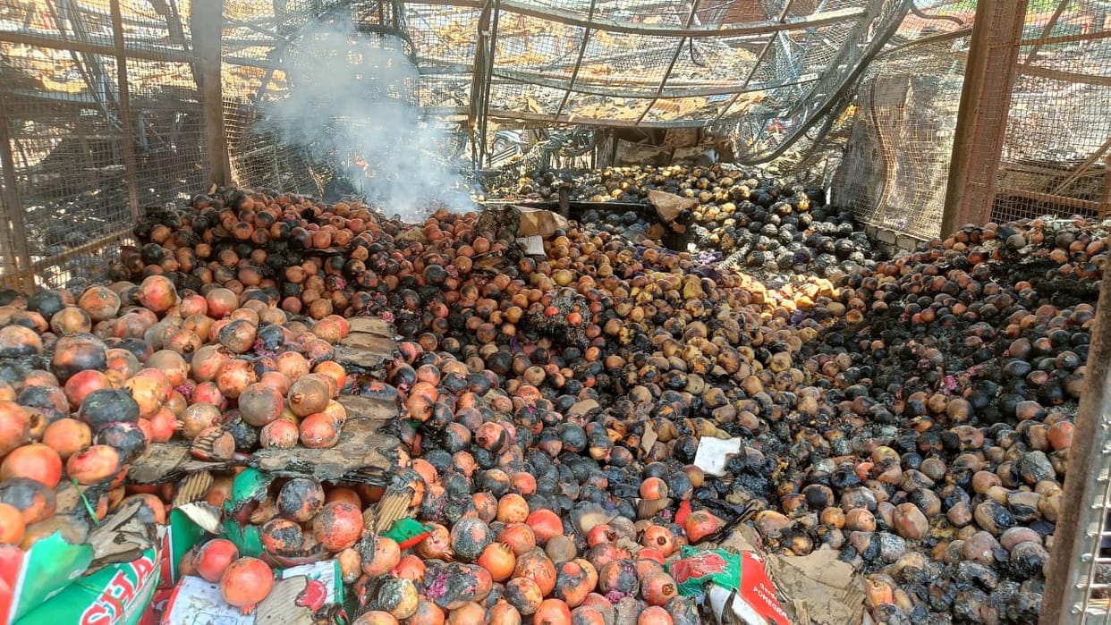 18 shops reduced to ashes in a fire.