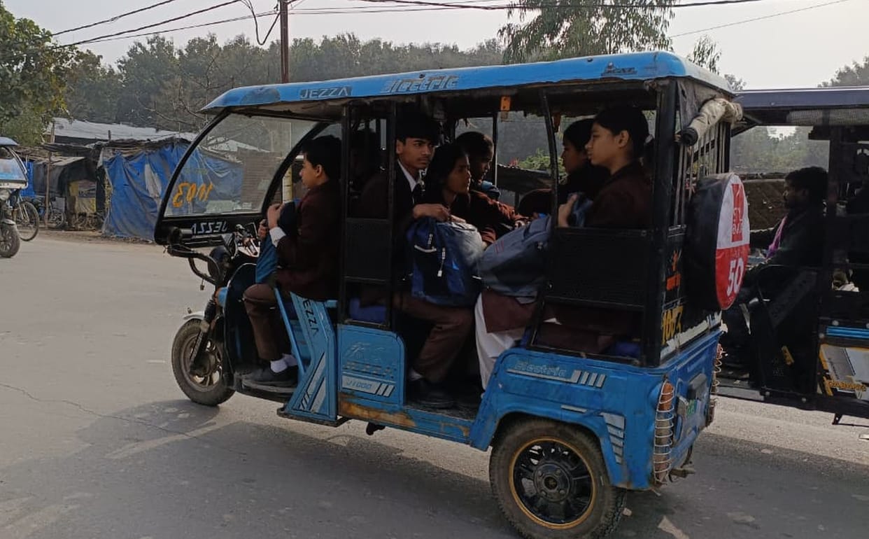 Children being transported by e-rickshaw
